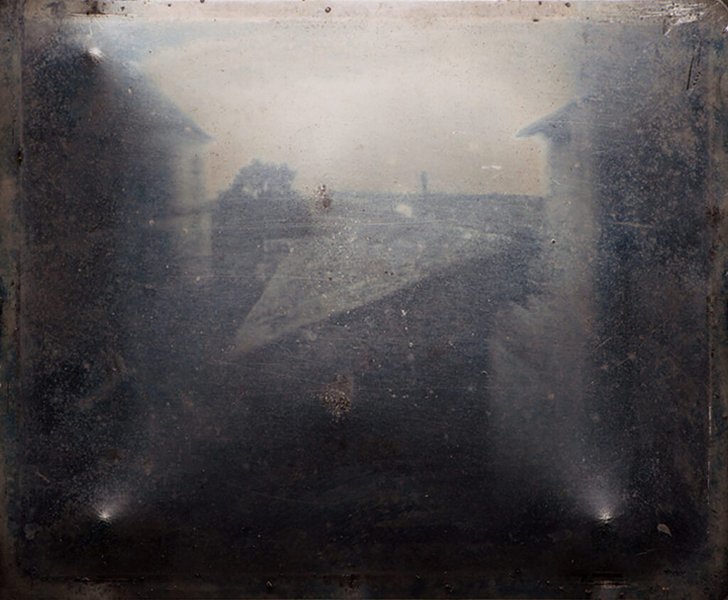 First picture ever taken with a camera by Nicéphore Niépce in 1827. Heliograph.